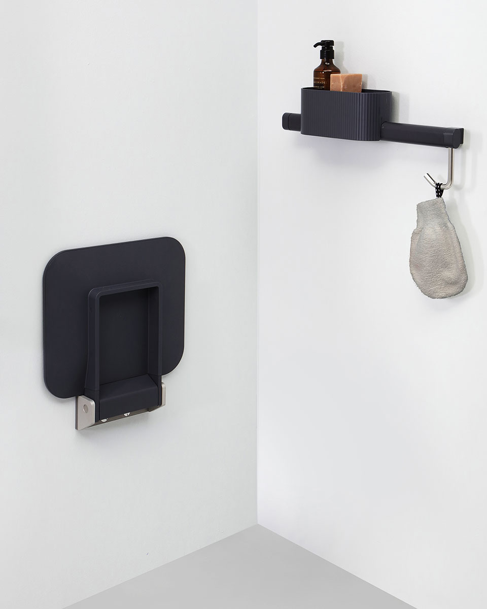 Folding shower seat