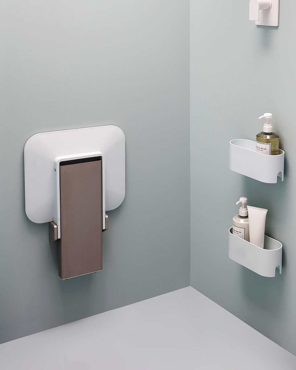 Folding shower seat with floor support
