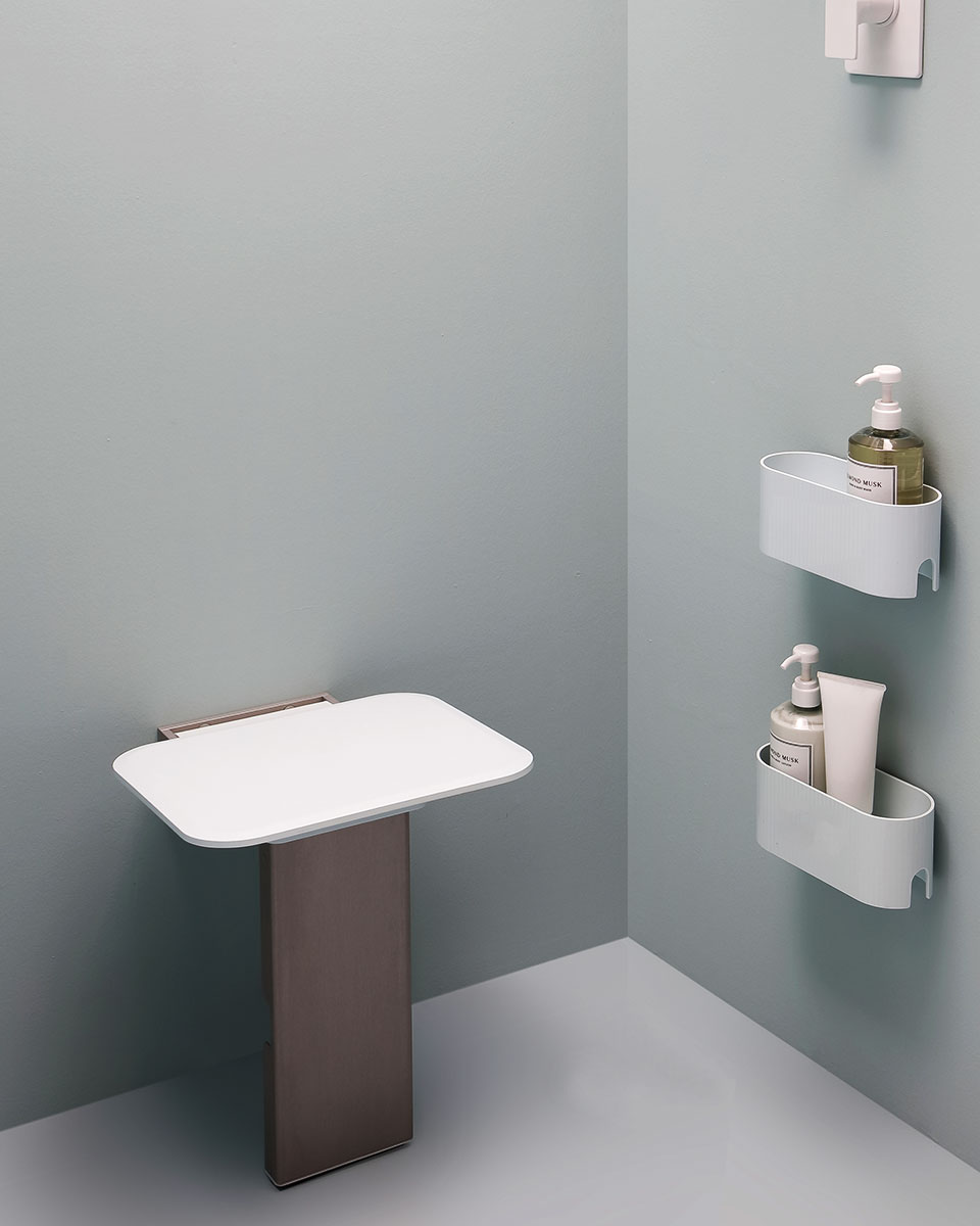 Folding shower seat with floor support