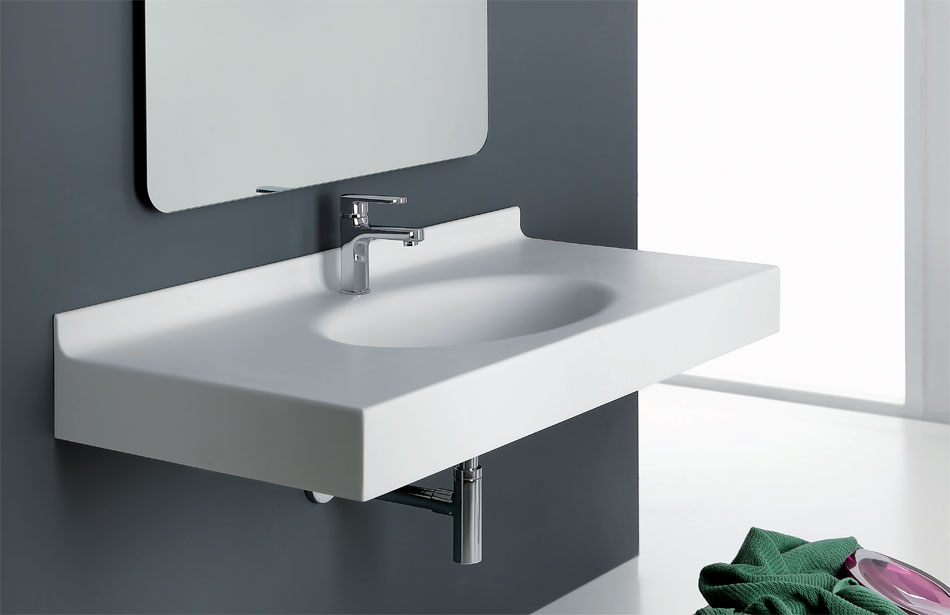 Lavabo in corian su misura con catino ovale singolo