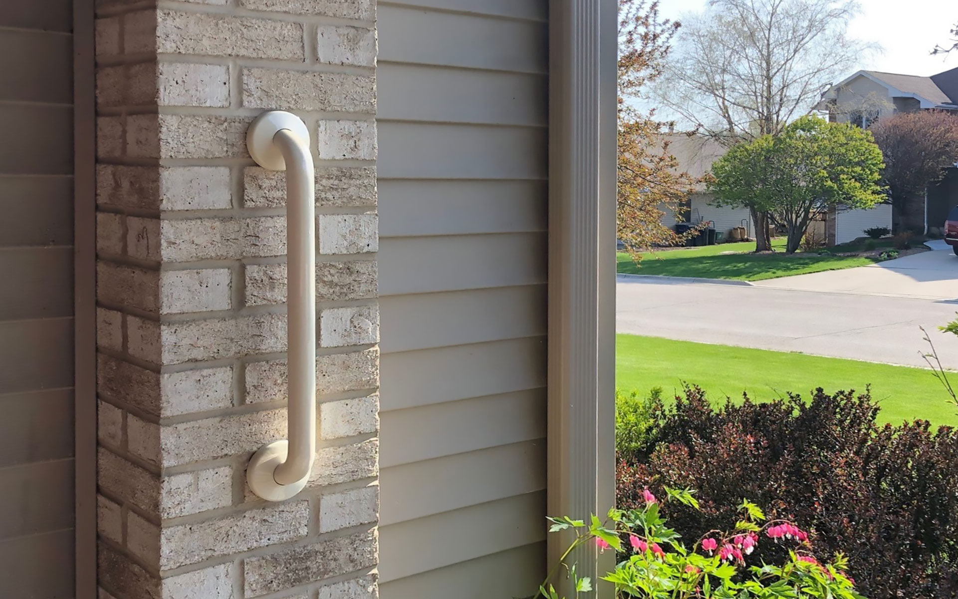 Vinyl-coated grab bars outside the home
